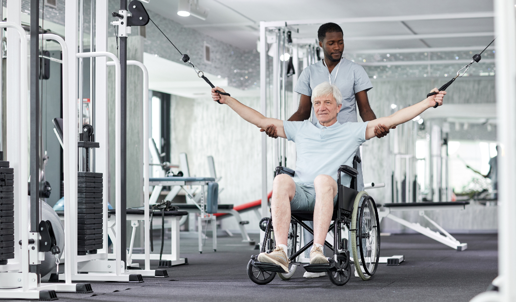 older man doing exercise in a wheelchair