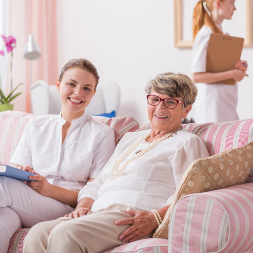 a nurse and an old lady smiling