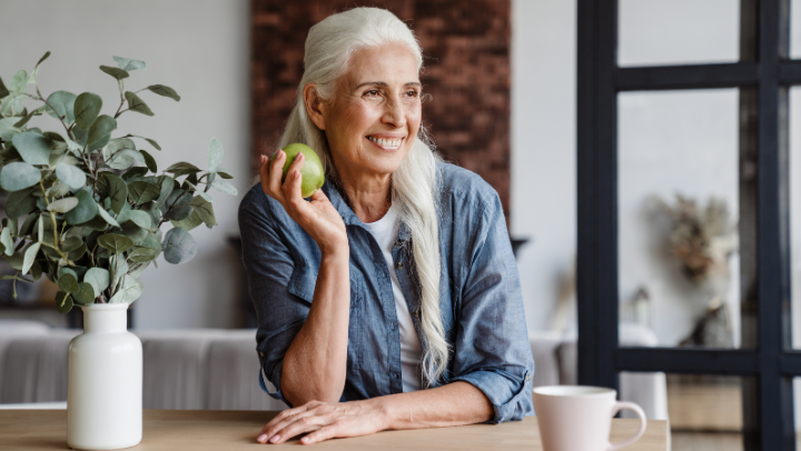 a senior eating an apple